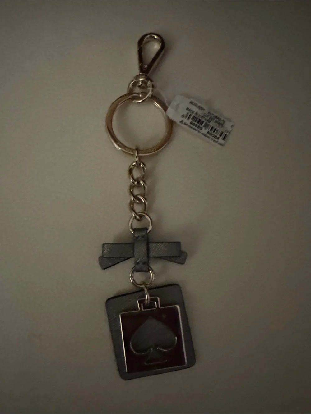 kate spade gray and gold bow spade charm key ring